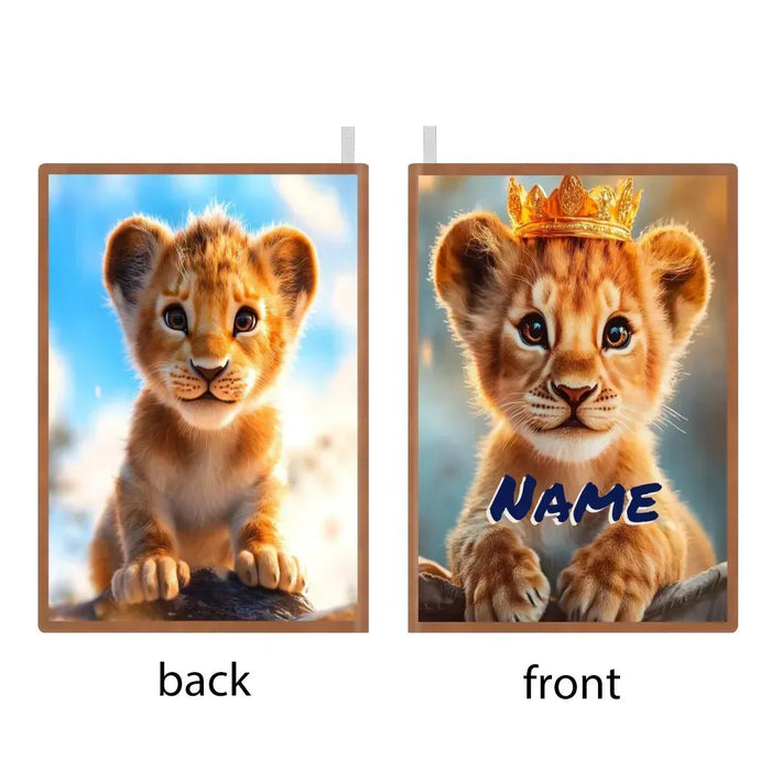 A5 notebook front and back views, featuring a lion cub with blue NAME text
