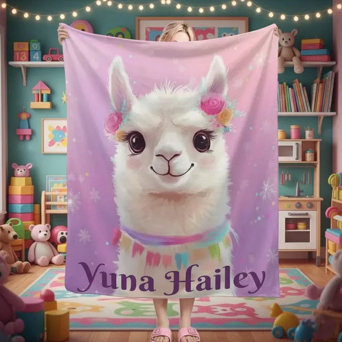 Pink fleece blanket with white llama face and custom name text
