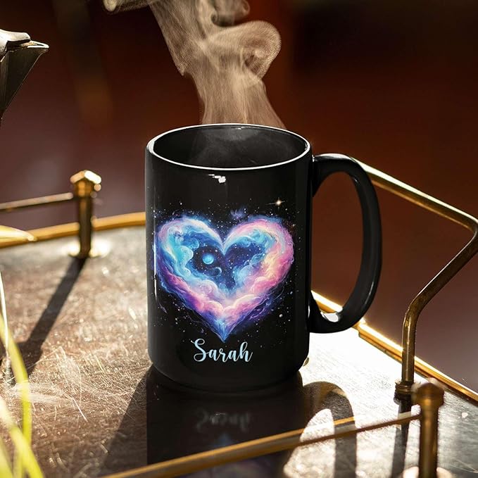 Black ceramic mug on a metal stand, galaxy heart graphic and name Sarah