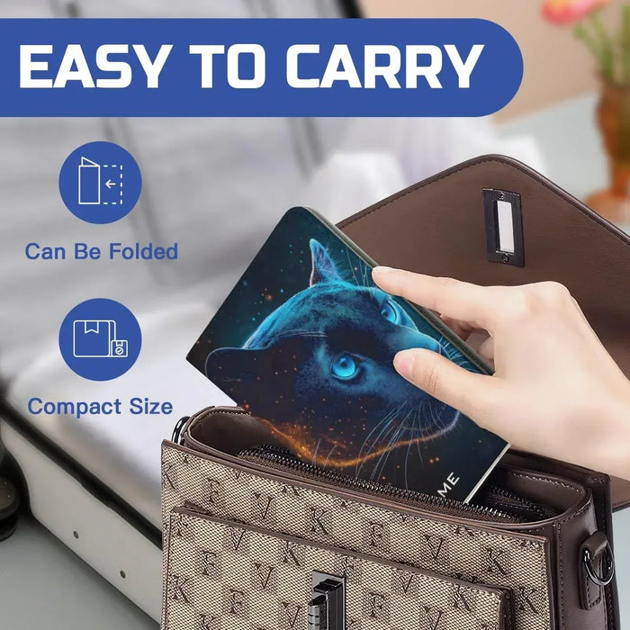 Passport holder pocketed in a larger bag, showing blue panther face design on cover