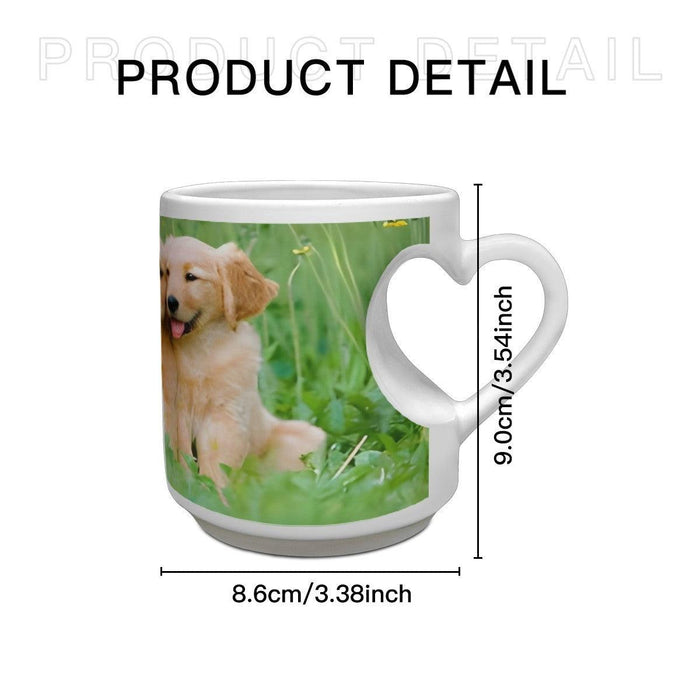 White ceramic mug with heart-shaped handle, golden retriever puppy photo, side view