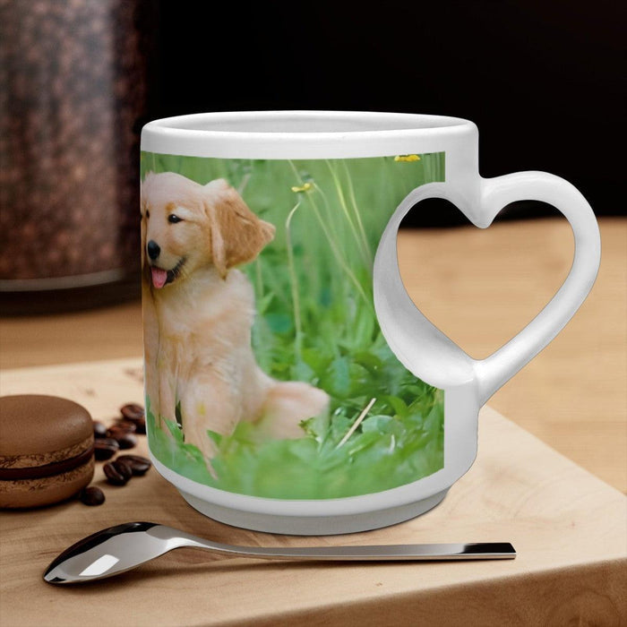 White ceramic mug with heart handle and golden retriever puppy print on the front