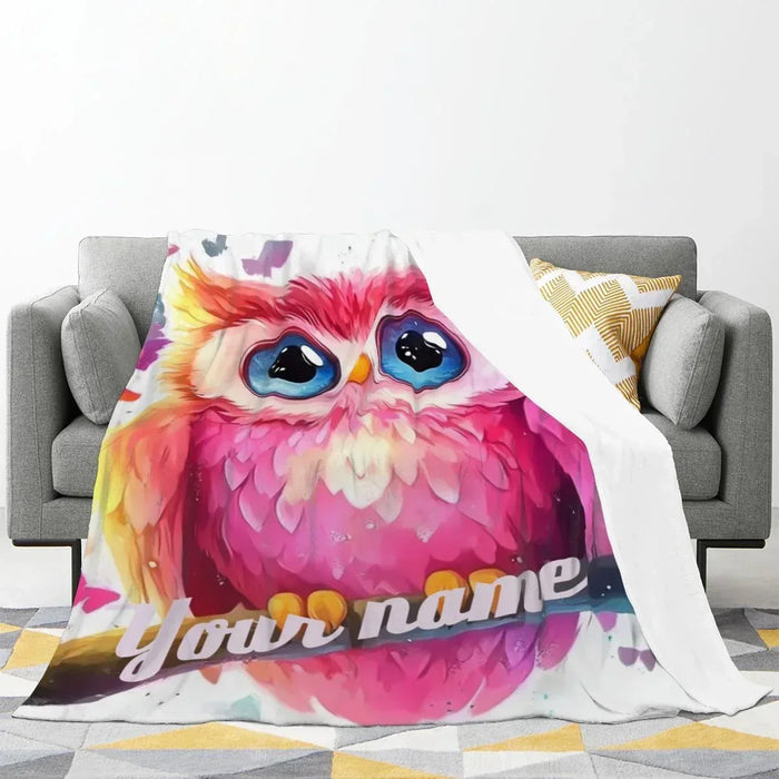 Pink owl fleece throw blanket with blue eyes and 'your name' text.