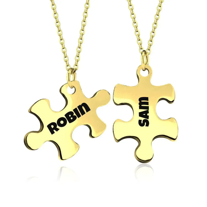 Gold puzzle pendant necklace set with two engraved puzzle charms on chain