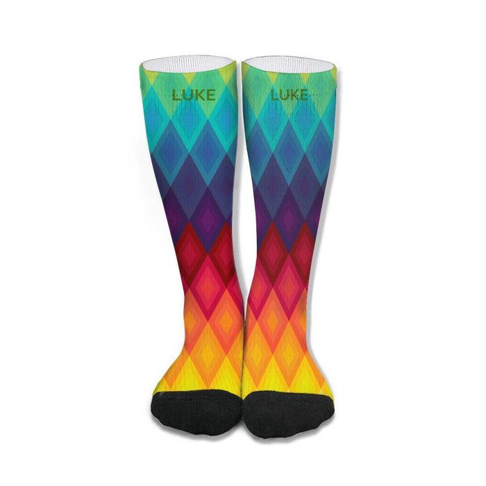 Mid-calf rainbow socks with chevron pattern, black toe and heel, branded cuffs