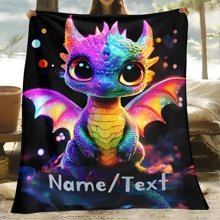 Black flannel fleece blanket with glowing rainbow dragon, wings, and Name/Text text