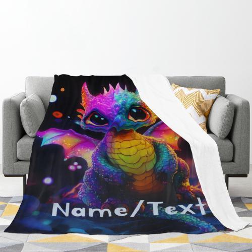 Rainbow dragon flannel blanket spread on a couch with Name/Text near the lower edge