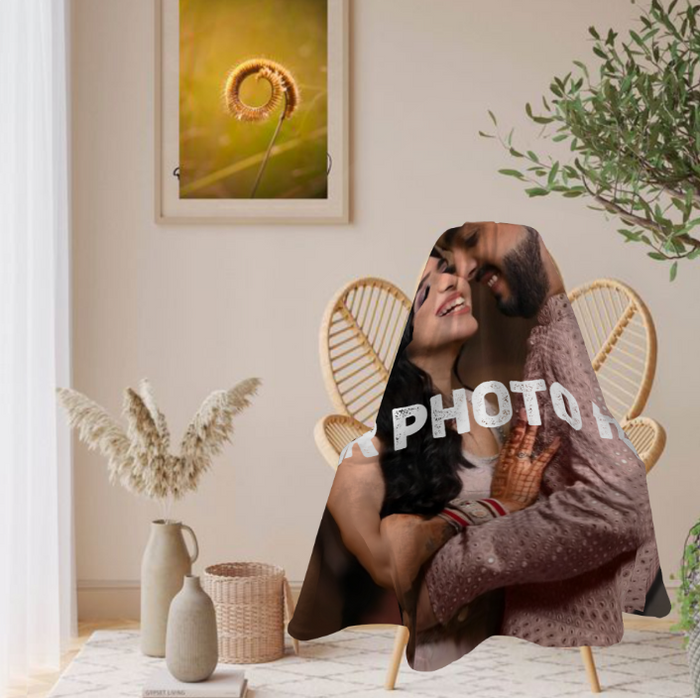 Round personalized photo blanket draped indoors, couple image with 'PHOTO' text
