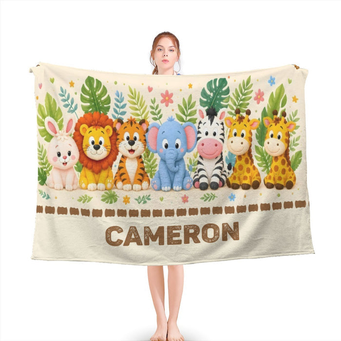 Personalized safari animal blanket with jungle print border and name “CAMERON”
