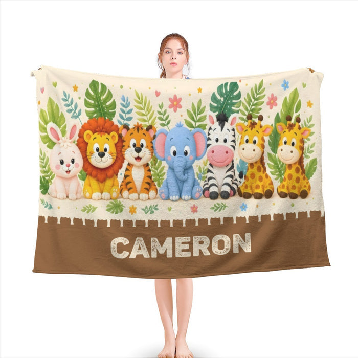 Safari animal blanket with white top, brown hem, and CAMERON name in large letters