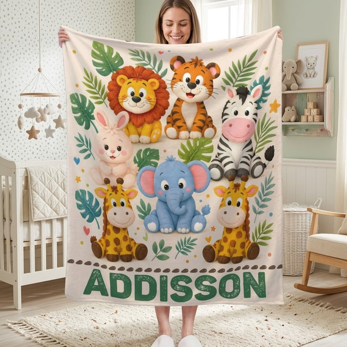 Personalized safari name blanket held in nursery, with animal print and “ADDISSON”