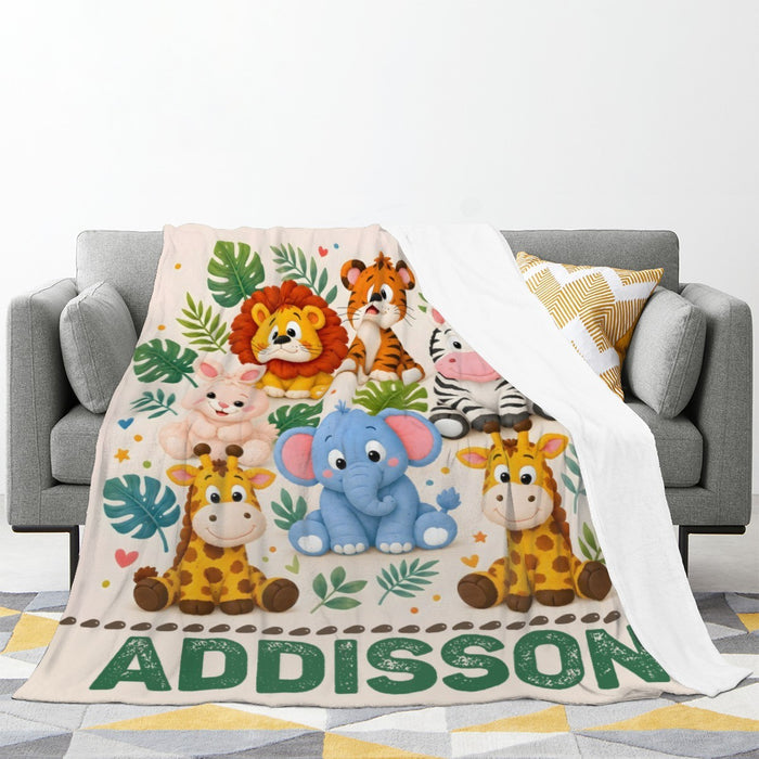 Personalized safari name blanket draped on sofa, featuring jungle animals and “ADDISSON”