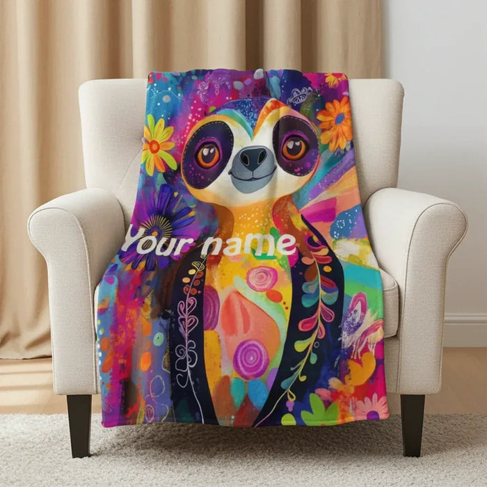 Customizable sloth flannel throw blanket with colorful floral art and name text