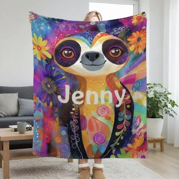 Custom sloth blanket with bright floral pattern and “Jenny” printed on it