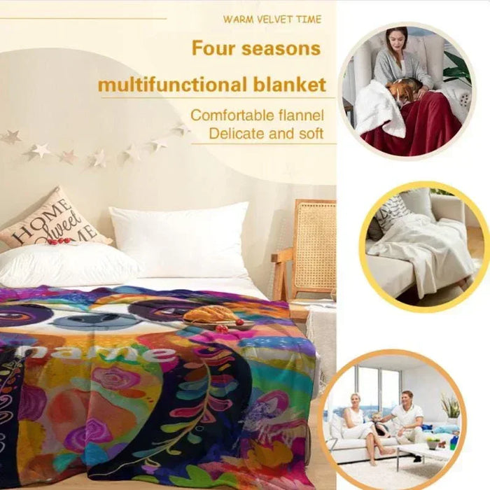 Multicolor sloth flannel blanket on bed with tropical floral artwork print