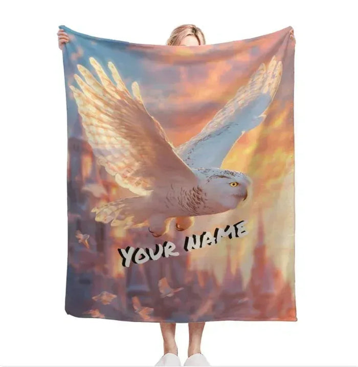 Fleece throw blanket, bird wing artwork with 'YOUR NAME' on a multicolor sky