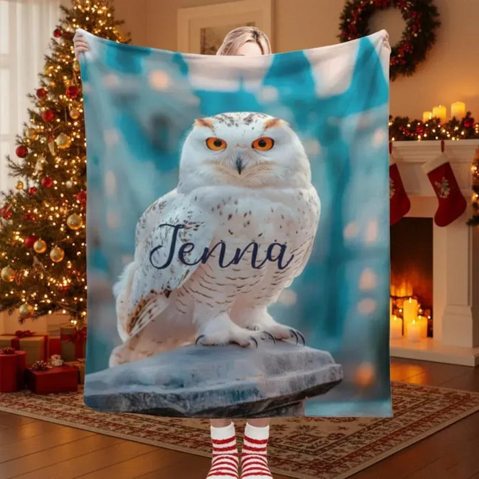 Personalized owl blanket with “Jenna” name text, held up and showing full design