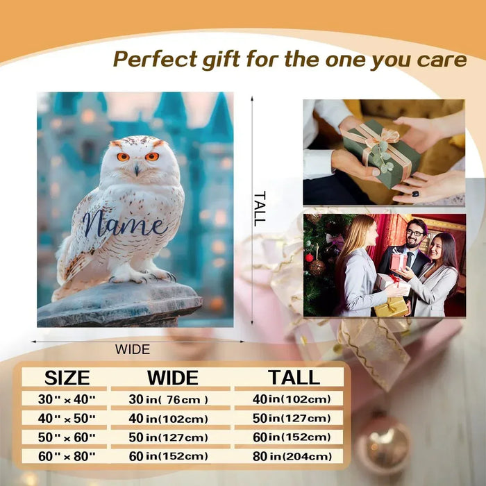 Personalized owl blanket with white owl face and script name on a blue design