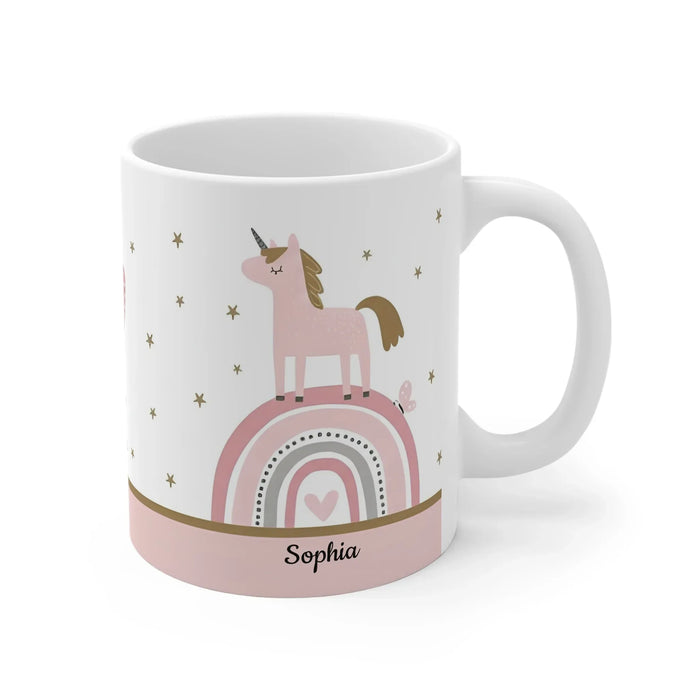White ceramic mug with unicorn above pink rainbow graphic and name Sophia