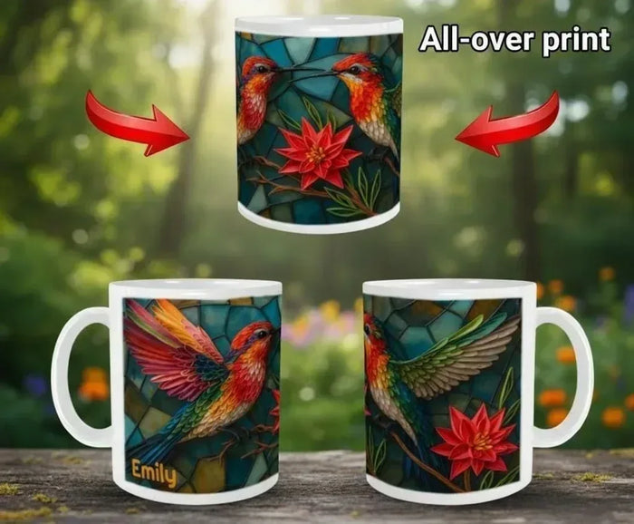 White ceramic coffee mug with all-over print of hummingbirds and red flower