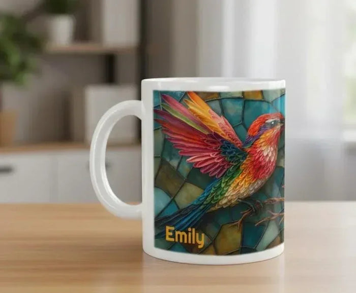 Ceramic coffee mug with stained-glass hummingbird art and name Emily on front