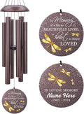 Bronze-tone dragonfly wind chime with speckled tubes and round "In Loving Memory" medallion.