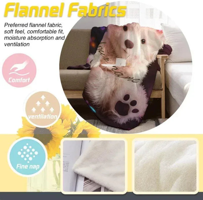 Teddy bear plush throw with floral accents and paw prints close-up