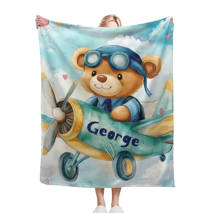 Personalised pilot teddy bear blanket with blue airplane design and George name on plane