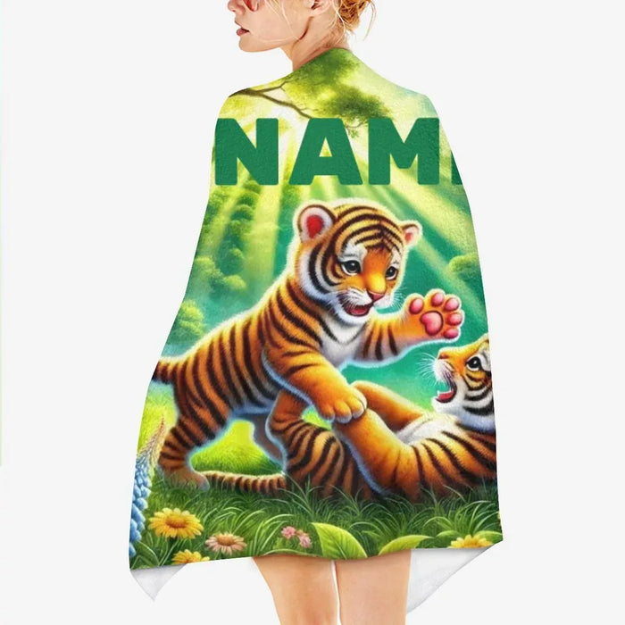 Kids beach towel with jungle tiger artwork and large 'NAME' text