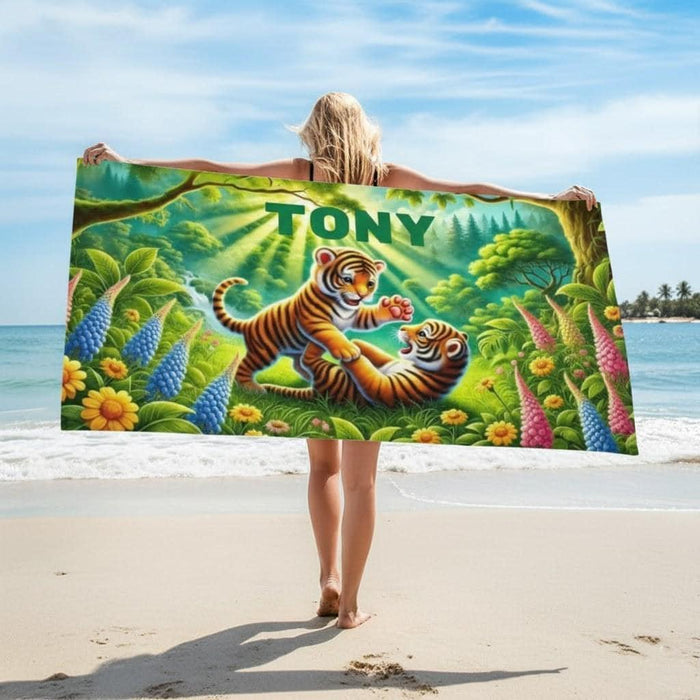 Jungle tiger beach towel stretched overhead with 'TONY' name and flowers
