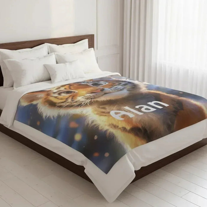 Personalized tiger blanket on bed, name Alan over orange tiger face print