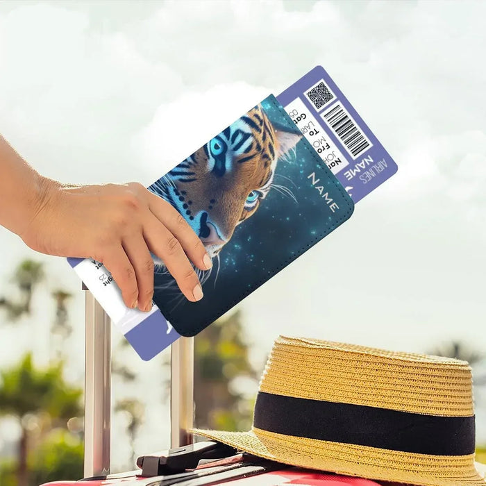 Tiger passport holder with name panel, held in hand with boarding pass card.