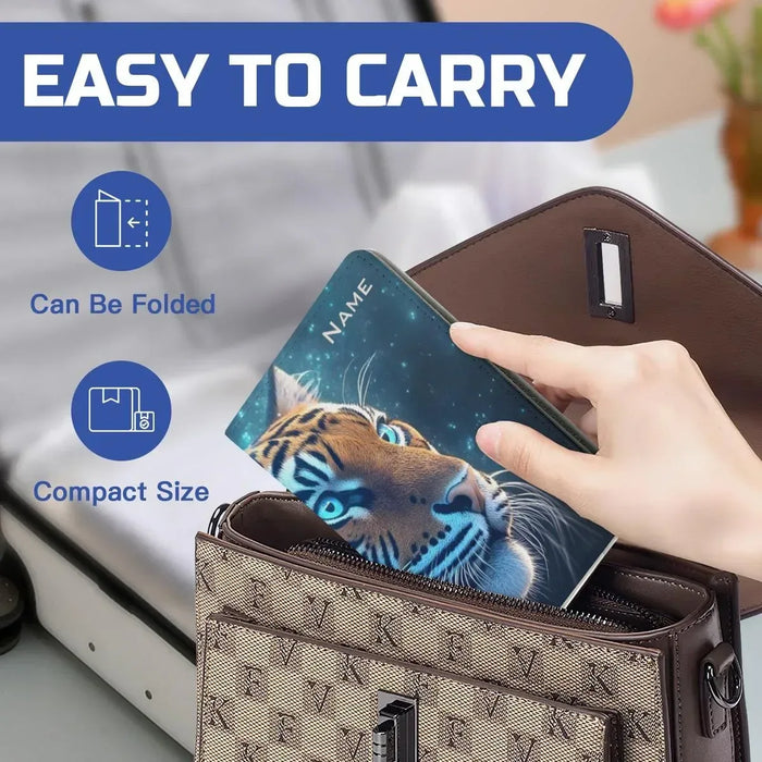 Tiger passport holder easy to carry, partially folded inside a handbag organizer.