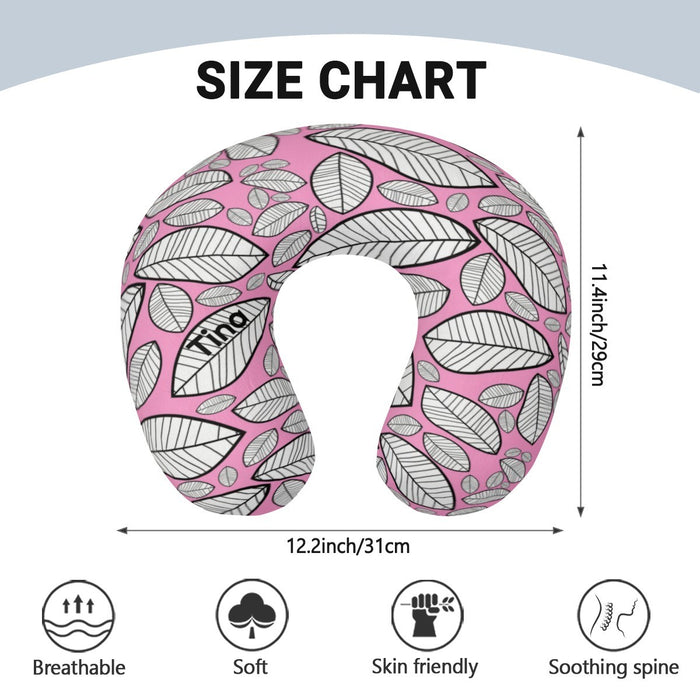 Leaf-print U-shaped neck pillow in pink and gray, shown with size dimensions