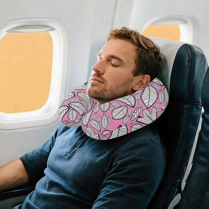 Leaf-pattern travel neck pillow worn on a man’s neck, pink and gray U-shape