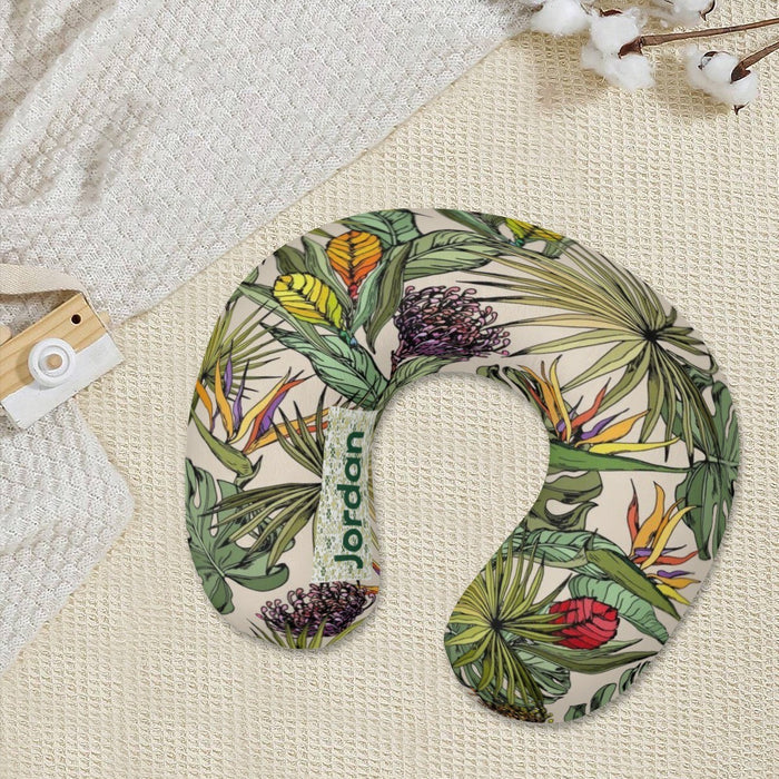 Personalized travel neck pillow on textured fabric, green tropical botanical print
