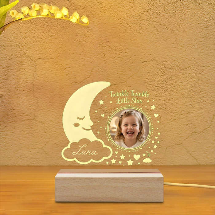 Star photo night light with moon and cloud icons, warm glow, circular picture window, wood base
