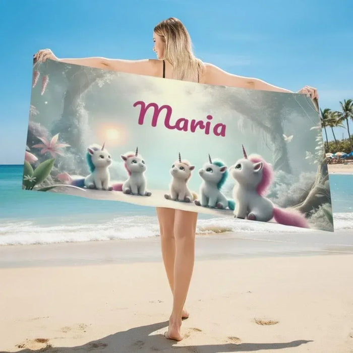 Personalized unicorn beach towel, light gray with pink name “Maria” and unicorn figures