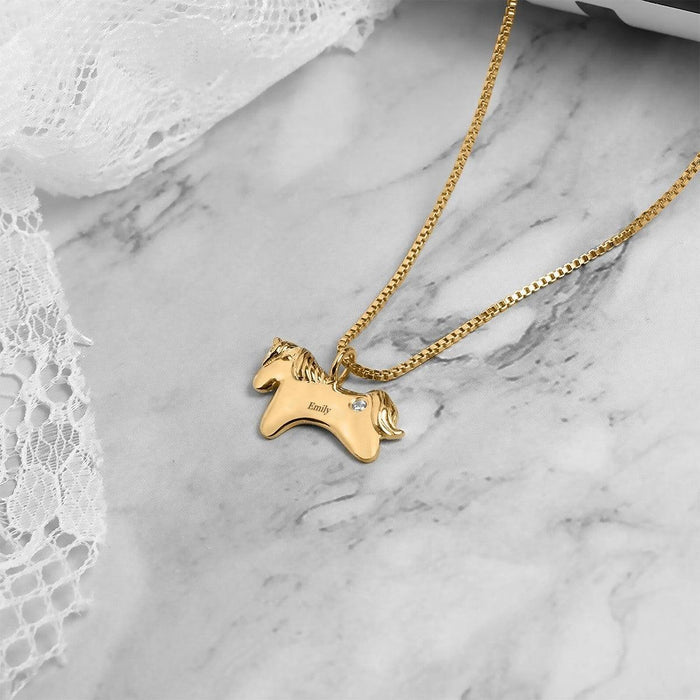 Gold unicorn birthstone pendant necklace on chain with small round gemstone