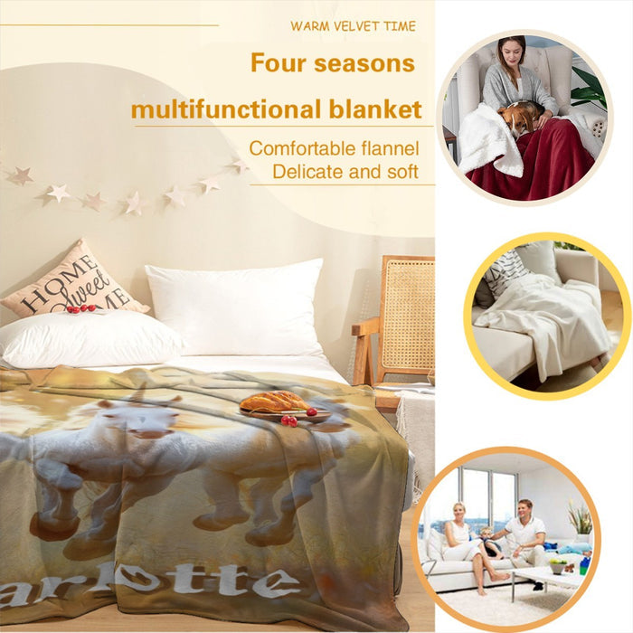 Unicorn-themed blanket with three white horses and “Charlotte” on bed