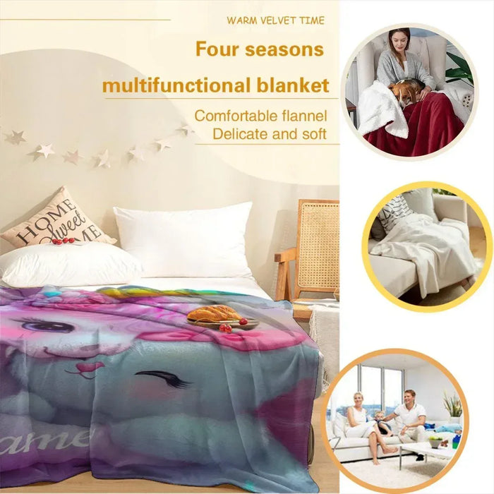 Unicorn plush blanket spread on bedding, colorful unicorn face print