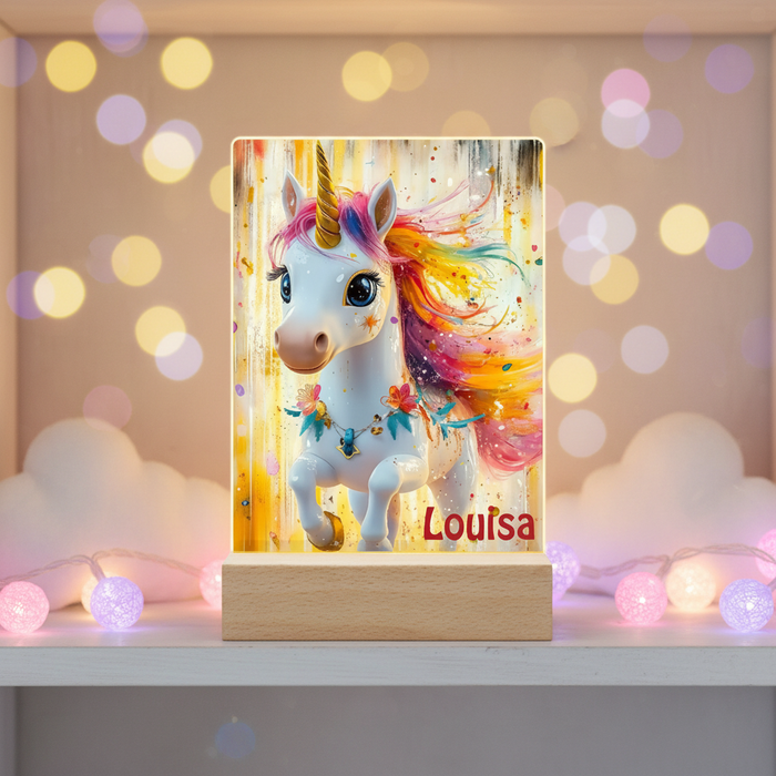 Unicorn night light on wooden base with colorful mane and “Louisa” name in bedroom decor