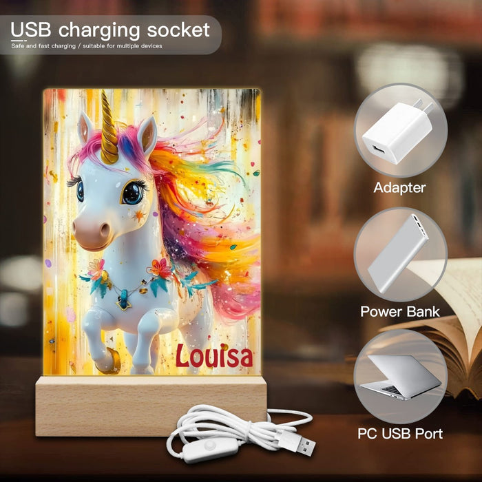 Personalized unicorn night light with wooden base, cables and “Louisa” name shown