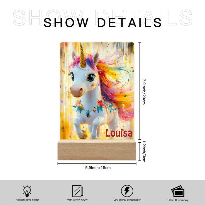 Unicorn night light with wooden base and size details; “Louisa” name on panel
