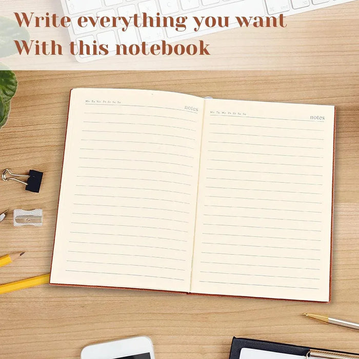 Open lined notebook with two writing panels on a wooden desk, metal rings visible.