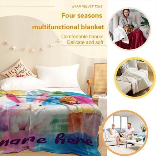 Rainbow patchwork bunny blanket draped on bed with large “Your name here” lettering