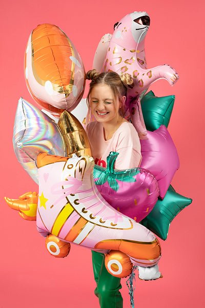 Assorted balloon animals, including a pink leopard-print dog balloon and star balloons.