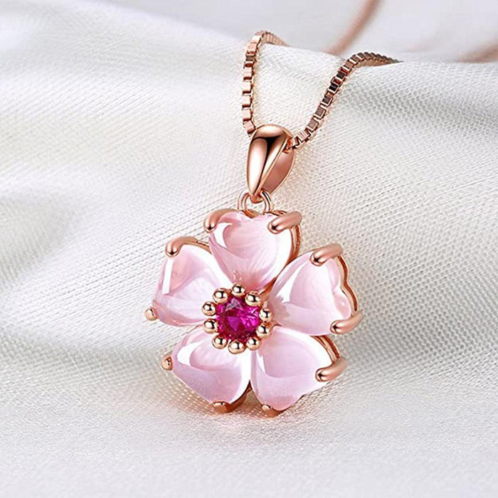 Sakura pendant necklace with rose-gold chain and pink flower charm with magenta center