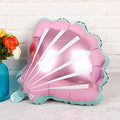 Seashell-shaped foil balloon in pink with teal ruffled edge and white stripe rays