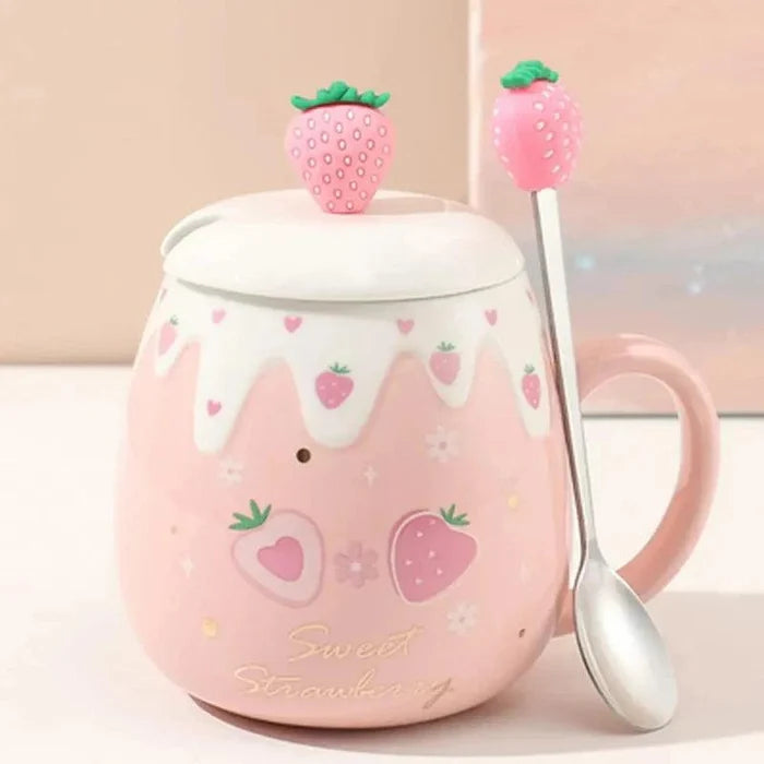 Pink ceramic mug with white lid, strawberry topper, and spoon; strawberry heart print